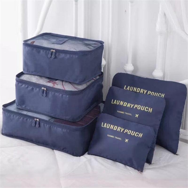 Kit Organizador de Malas para Viagem em uso, mantendo a bagagem organizada. Cor azul.