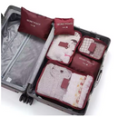 Organizadores de mala compactos, perfeitos para mochilas de mão e bagagens pequenas. Cor vinho.